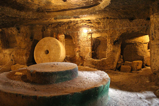 AN 11TH CENTURY OLIVE OIL MILL SCULPTED OUT OF ROCK
